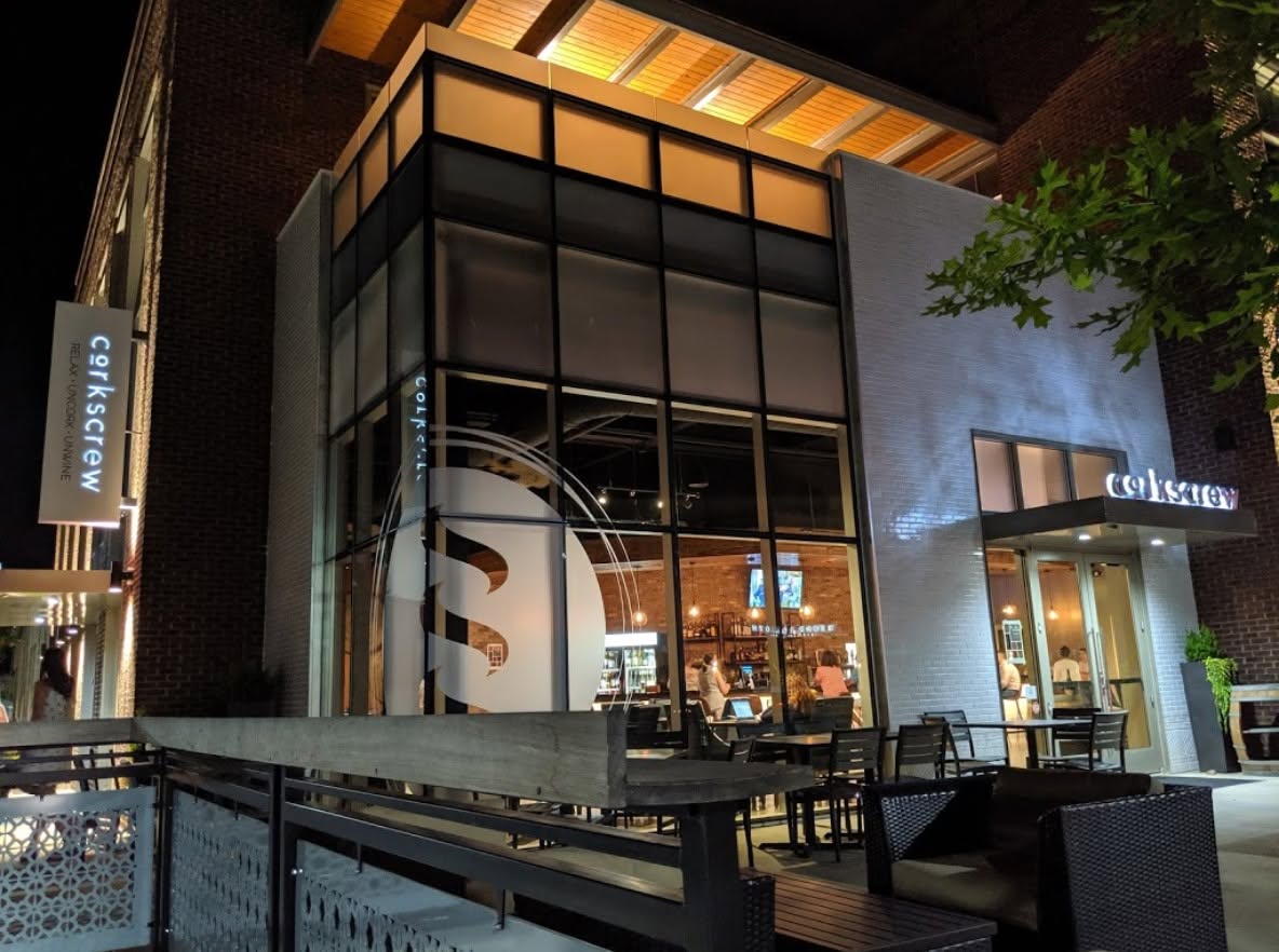 Corkscrew Wine Bar storefront at night in Kingsley Town Center, Fort Mill